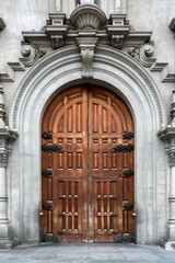 Large classically designed arch door at a historic church in Peru
