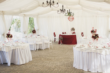 Beautiful Banquet hall under a tent for a wedding reception.