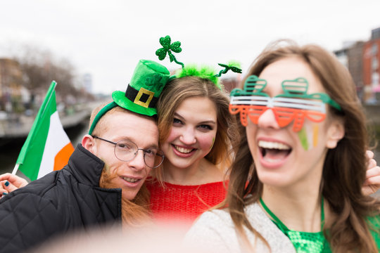 Group of Friends Taking a Picture with a Mobile Phone . St Patri