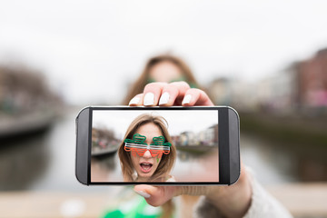 Young Beautiful Woman Taking a Picture for St Patrick's Day . Du