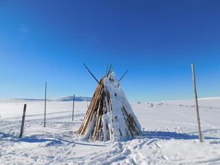 Wigwam on the covered with snow lowland © Anastasi