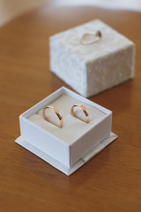 Engagement rings in wooden box.