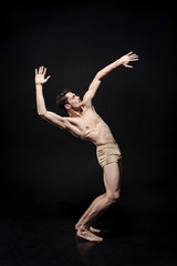 Inspired young ballet dancer moving in the studio © zinkevych