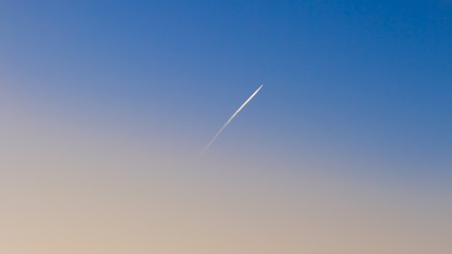 Trace of the plane in the clear sky