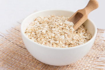Rolled oats, porridge  for a healthy breakfast in a rustic style