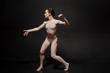 Fototapeta na wymiar Charismatic young ballet dancer realizing her abilities and skills