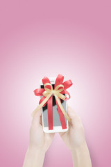modern touch-screen mobile phone with ribbon on white background