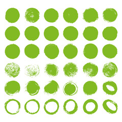 Hand drawn abstract green paint brush circle labels and shapes on white background. Vector natural painted stains set collection.