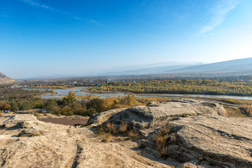 Fototapeta na wymiar View of Georgia, distant rive and forests