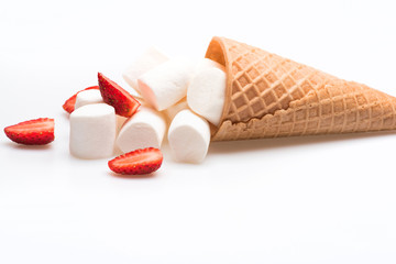 ice cream cone with marshmallow and strawberry on white background