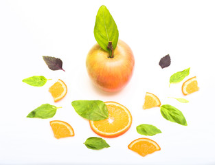 green mint leaves, apple and orange dessert isolated on white