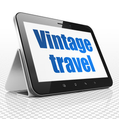 Vacation concept: Tablet Computer with Vintage Travel on display