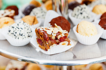 Different candies, cookies and biscuits on banquet table.