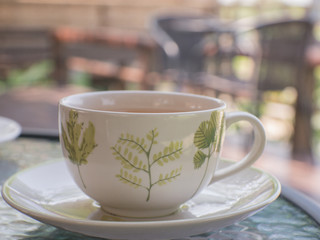 Coffee cup on a table.