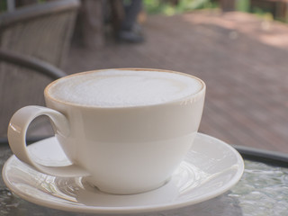 Coffee cup on a table.