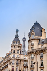 Fototapeta na wymiar Parisian apartment building, and the Eiffel Tower on the background