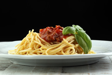 Plate of delicious spaghetti Bolognaise or Bolognese with savory