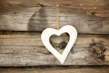 White heart on rustic wooden background