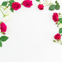 Frame with red, white roses and leaves isolated on white background. Flat lay, top view  Valentine's background