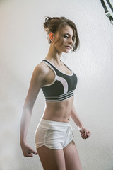 Obraz premium beautiful young girl is engaged in sports and fitness