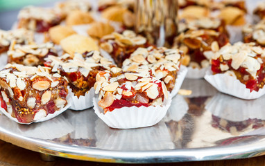 Different candies, cookies and biscuits on banquet table.