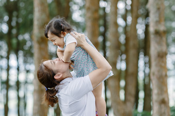 Fototapeta premium The little girl A kid with mom Funny