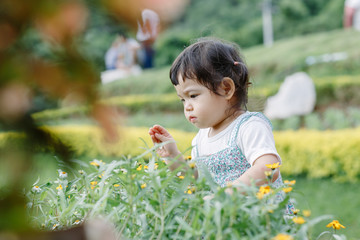 The little girl Running for fun in the garden.