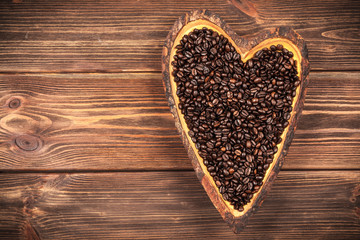 Coffee beans in a heart shaped bowl