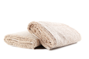 Beige towel isolated on a white background