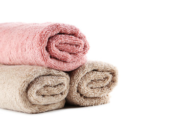 Obraz na płótnie Canvas Rolled up towels isolated on a white background