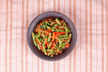Spicy fried cowpea with minced pork call Pad Ped Tua.