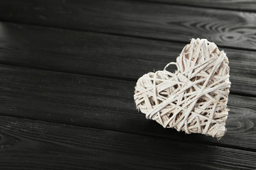 Love heart on a black wooden background