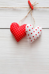 Valentine day background, pillow hearts couple on wood, copy space