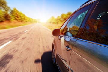 Blurred road and car, speed motion background