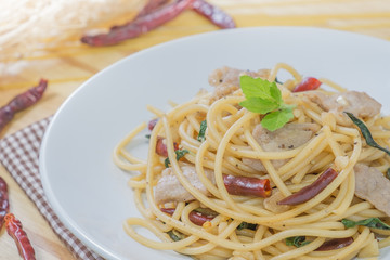 Spicy spagetti with stir-fried pork , dried chilli and basil : Thailand style food