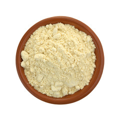Soy powder in a small bowl on a white background top view.