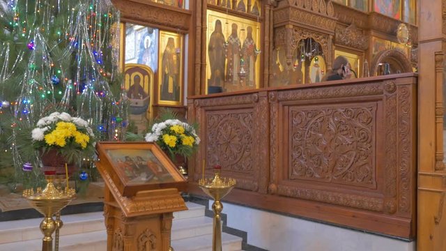 Impressive Iconostasis With Golden Looking Icons Inside of an Old Orthodox Cathedral on the Eve of New Year`s Day