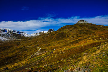 Great landscape with fall colors and new snow on the mountain tops, in western Norway