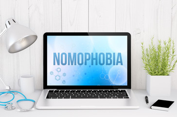 medical desktop computer with nomophobia on screen