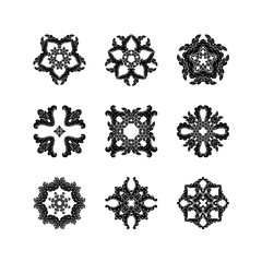Set of ornate vector mandala symbols. Mehndi lace tattoo. Oriental weave.