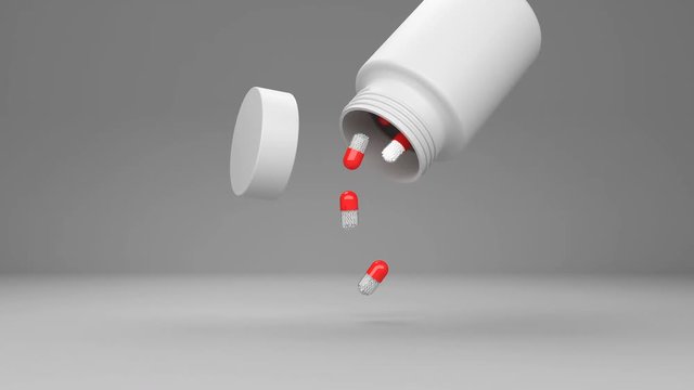 pills droping from a bottle on greay background animation for use in presentations, education manuals, design, etc