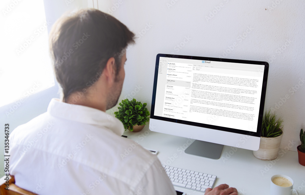 Poster man using mail client on computer