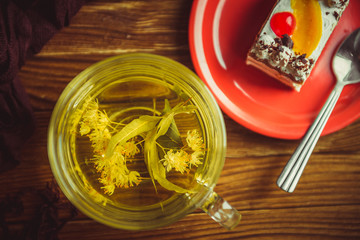 cup of tea and cake on a wooden table