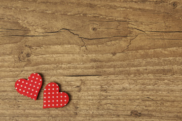 Valentine's Day concept. Holiday card with hearts.Abstract backround made of hearts symbols on old wooden background