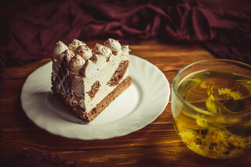 cup of tea and cake on a wooden table
