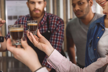 Well-made tasty espresso in hands of woman