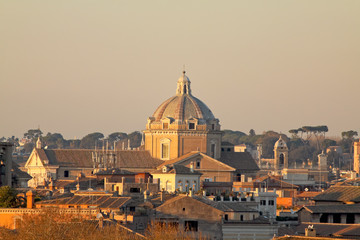 Fototapeta na wymiar View of Rome roofs: Chiesa del Gesù Dome (Jesus's Church) and C