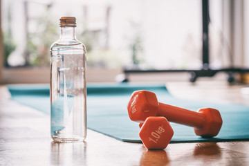 Pair of dumbbells on a wooden floor