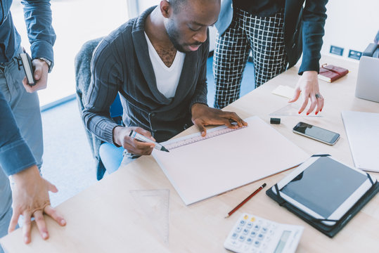 Multiracial business people working together connected with technological devices like tablet and notebook - teamwork, business, working concept