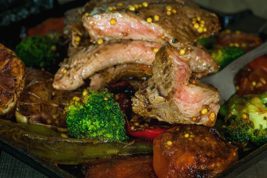 beef steak with Dijon mustard, cabbage, broccoli, garlic, vegetables, grilled